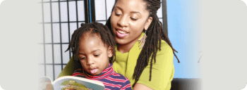 Woman reads to her little boy