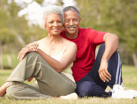 Senior couple resting after exercise smiling